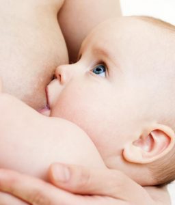 Little baby girl breast feeding